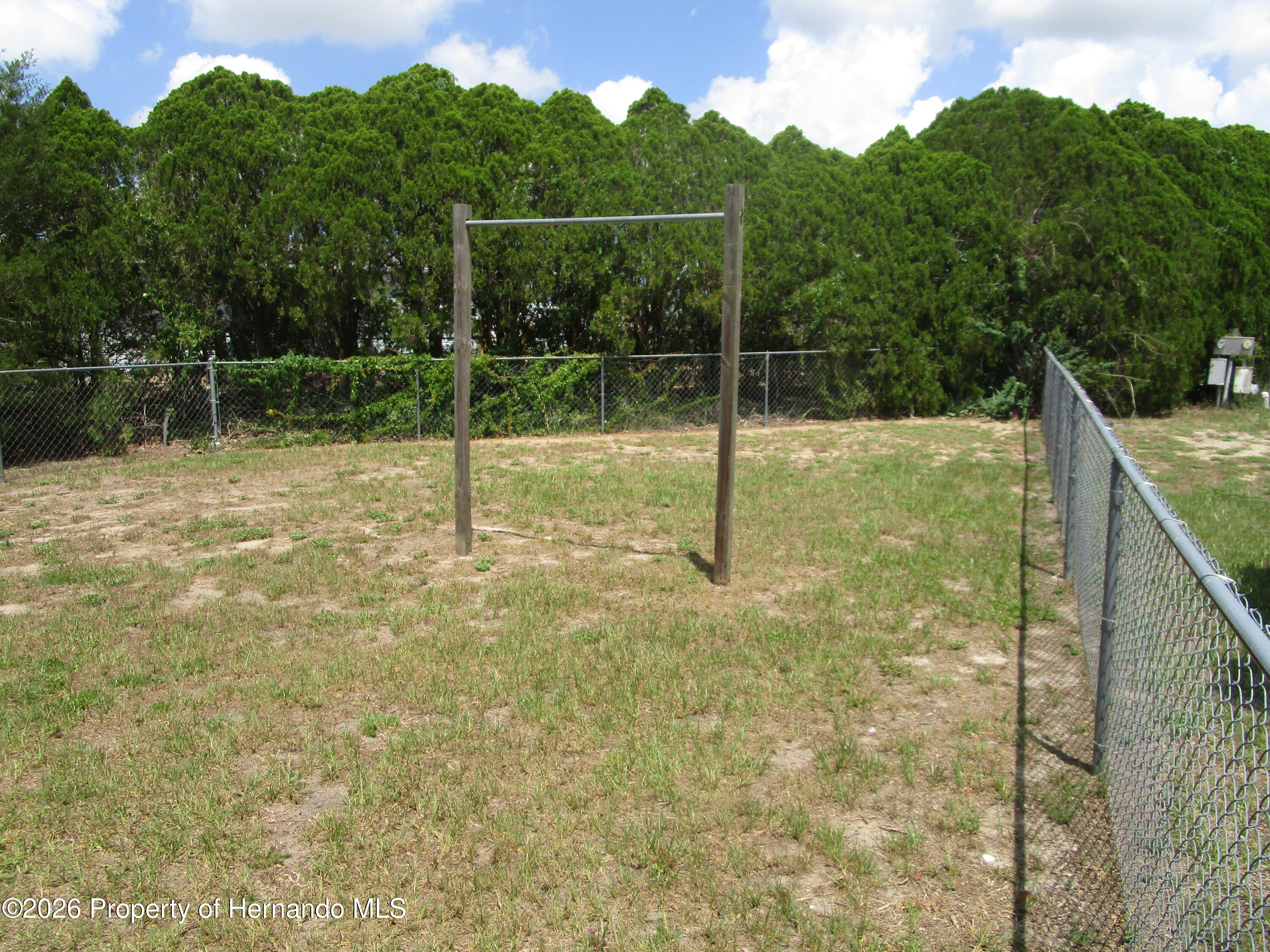 14790 Rialto Avenue, Unit 3 Brooksville, FL 34613 - Photo 15 of 15 a backyard of a house with lots of green space