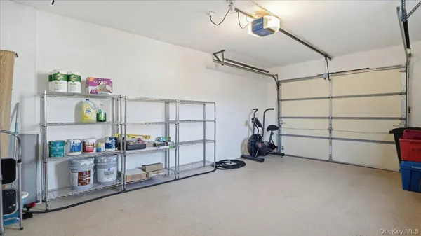 a view of gym equipment and children in a room