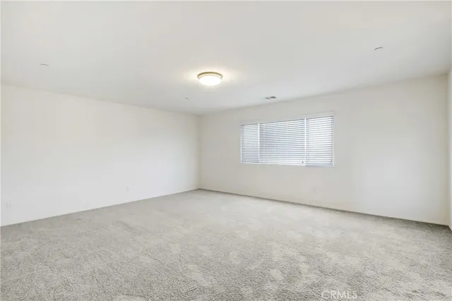 an empty room with a empty space and window