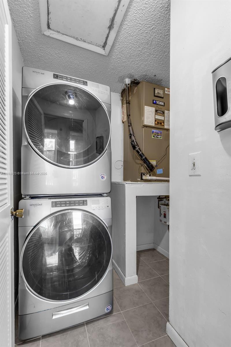 6713 Northwest 188th Terrace, Unit 6713 Hialeah, FL 33015 - Photo 11 of 28 a utility room with dryer and washer