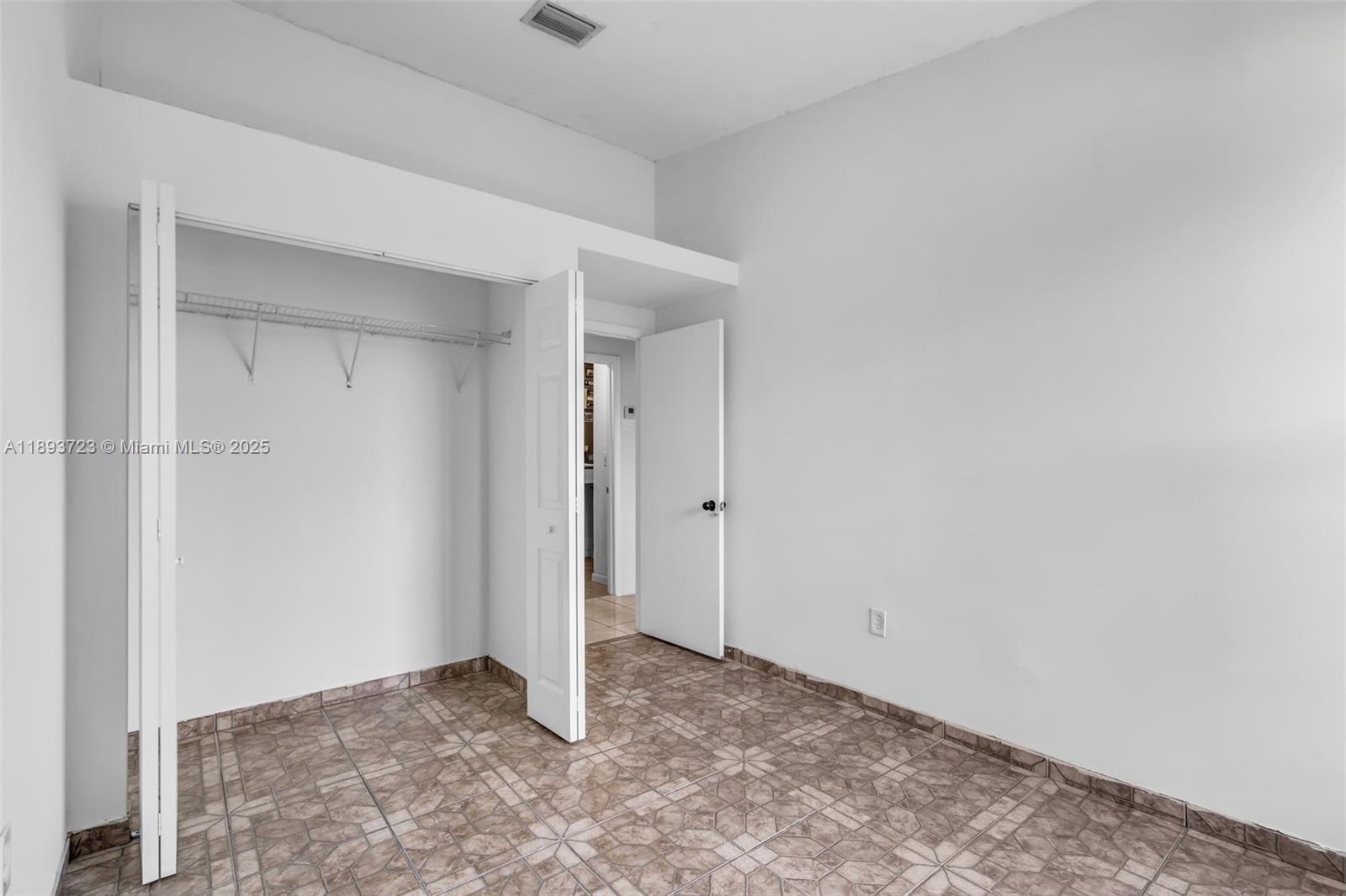 6713 Northwest 188th Terrace, Unit 6713 Hialeah, FL 33015 - Photo 19 of 28 a view of an empty room
