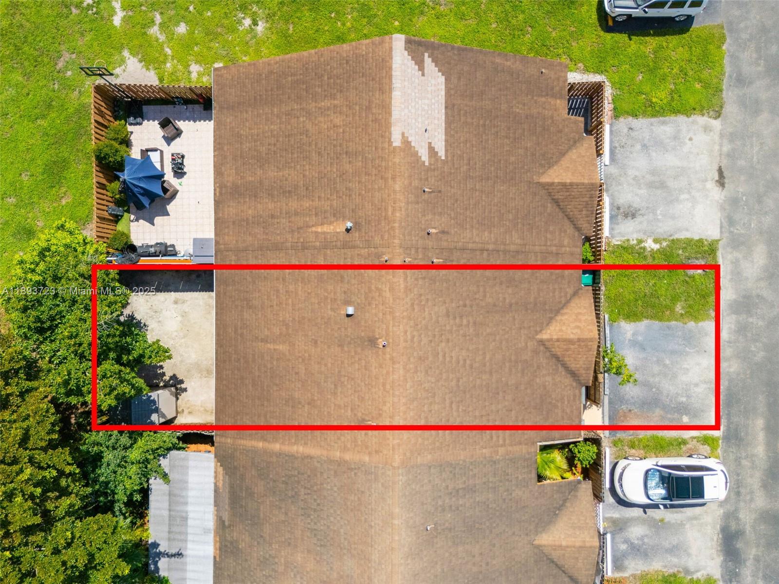 6713 Northwest 188th Terrace, Unit 6713 Hialeah, FL 33015 - Photo 25 of 28 an aerial view of a house with a yard and tennis court