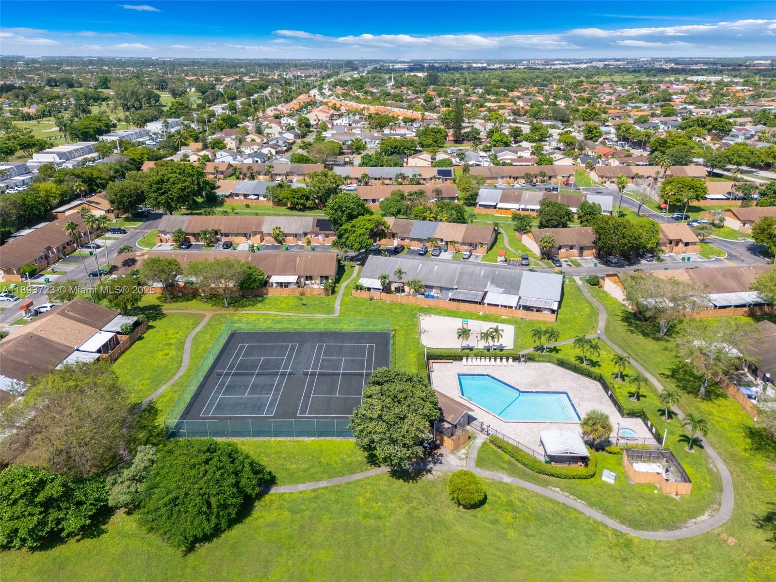 6713 Northwest 188th Terrace, Unit 6713 Hialeah, FL 33015 - Photo 27 of 28 an aerial view of a house with a garden