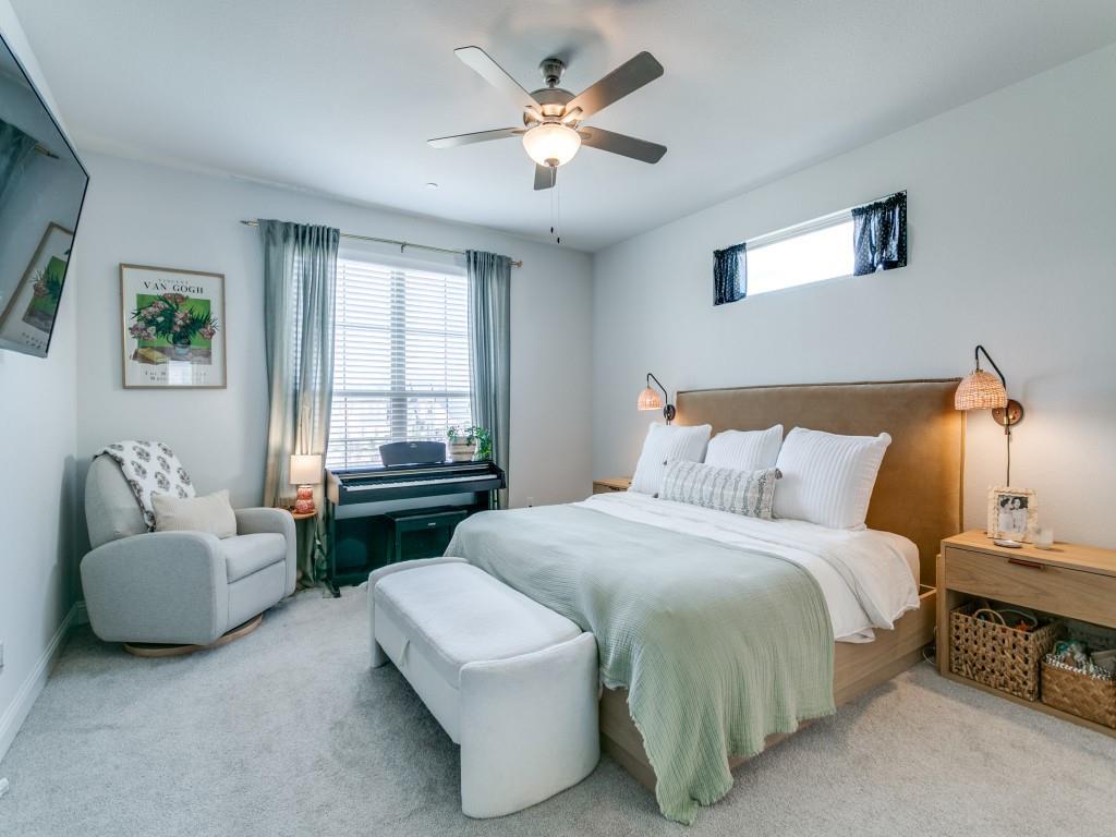 12964 Rockham Lane Dallas, TX 75234 - Photo 13 of 24 a bedroom with a bed couch and window