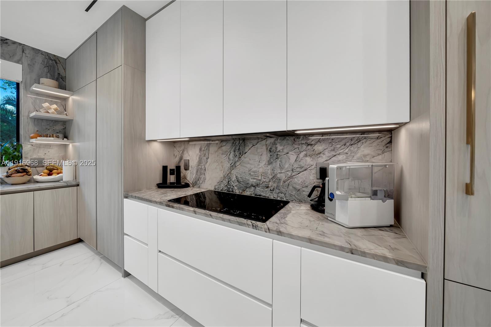 34 Southwest 26th Road Miami, FL 33129 - Photo 27 of 68 a kitchen with a sink and cabinets