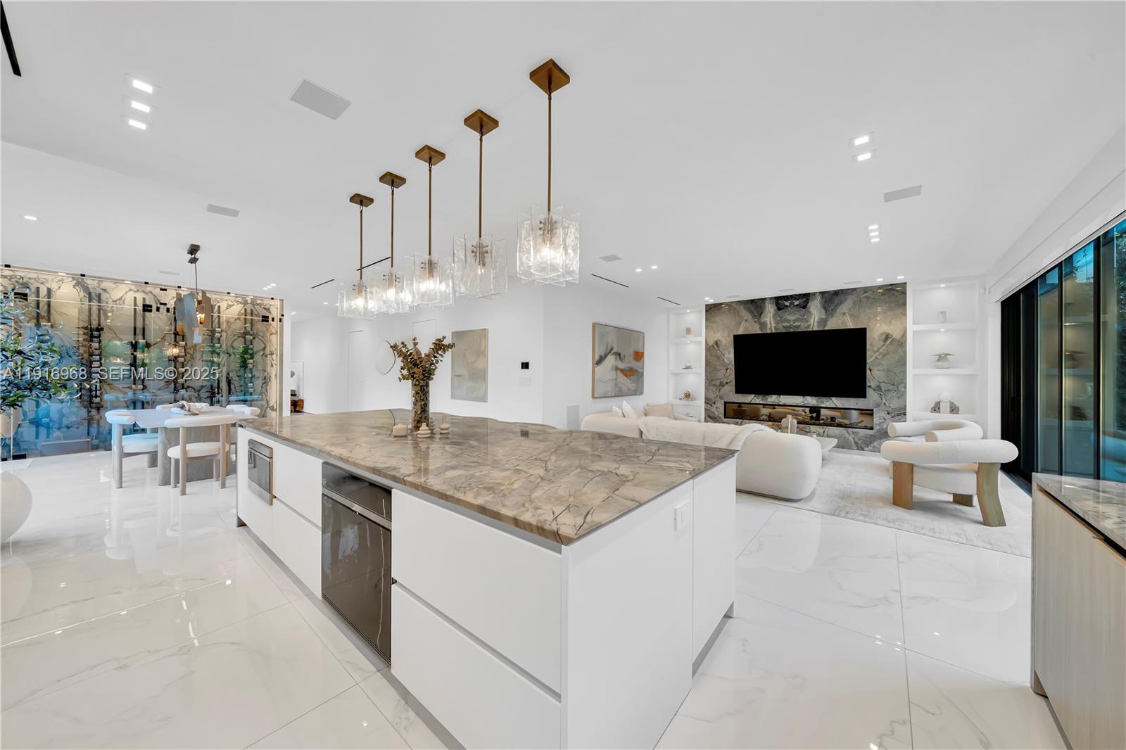 34 Southwest 26th Road Miami, FL 33129 - Photo 29 of 68 a kitchen with stainless steel appliances kitchen island granite countertop a sink and a fireplace