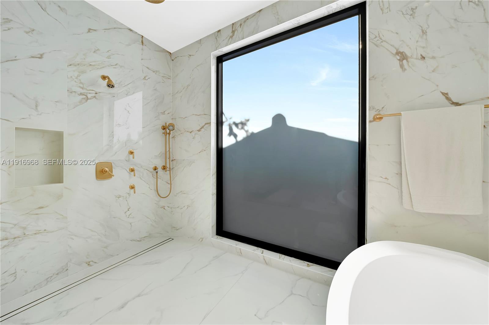 34 Southwest 26th Road Miami, FL 33129 - Photo 45 of 68 a bathroom with a bathtub and a shower