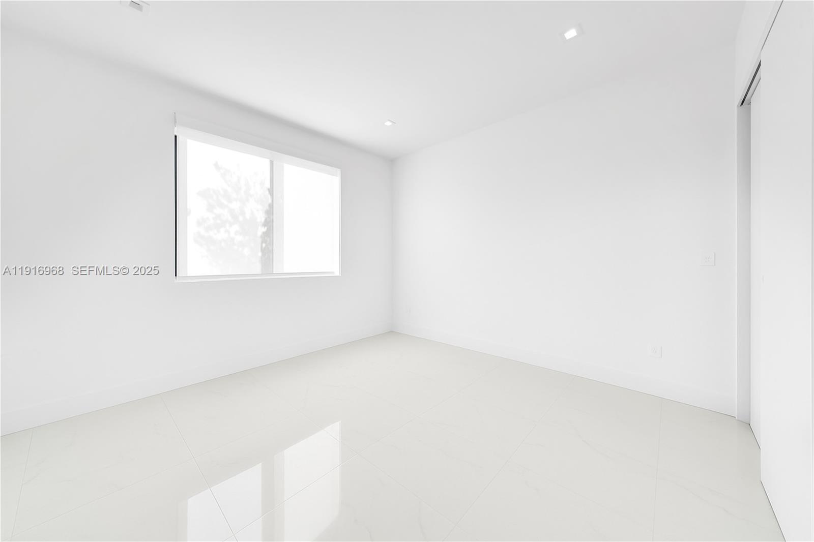 34 Southwest 26th Road Miami, FL 33129 - Photo 52 of 68 an empty room with a window