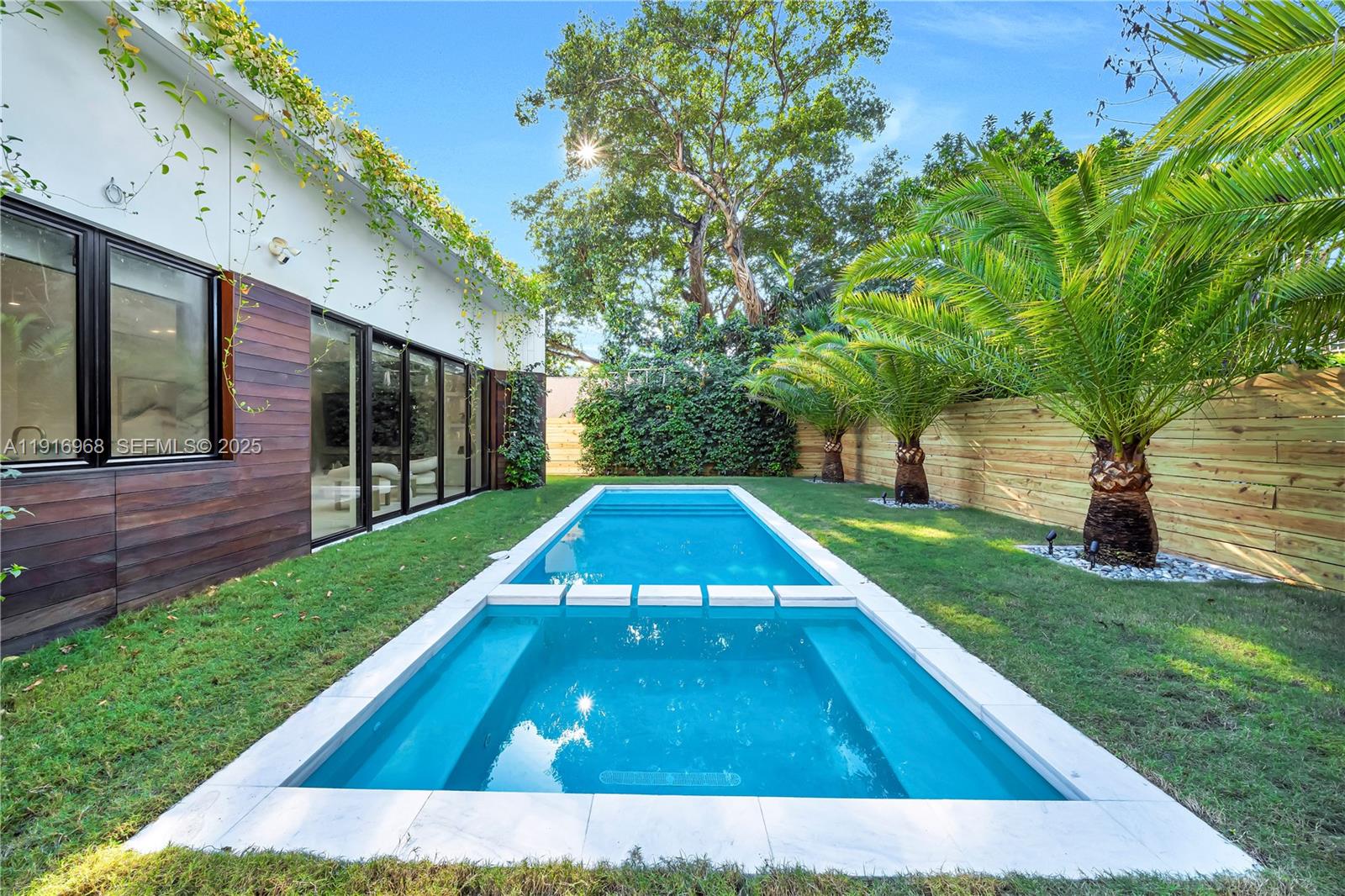 34 Southwest 26th Road Miami, FL 33129 - Photo 55 of 68 a view of a backyard with a small cabin