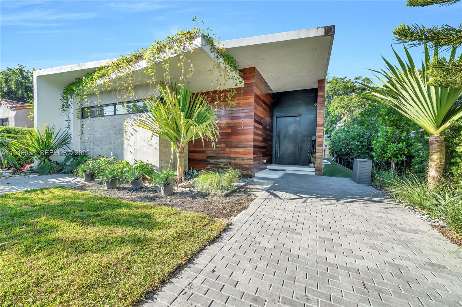 34 Southwest 26th Road Miami, FL 33129 - Photo 6 of 68 a front view of a house with garden