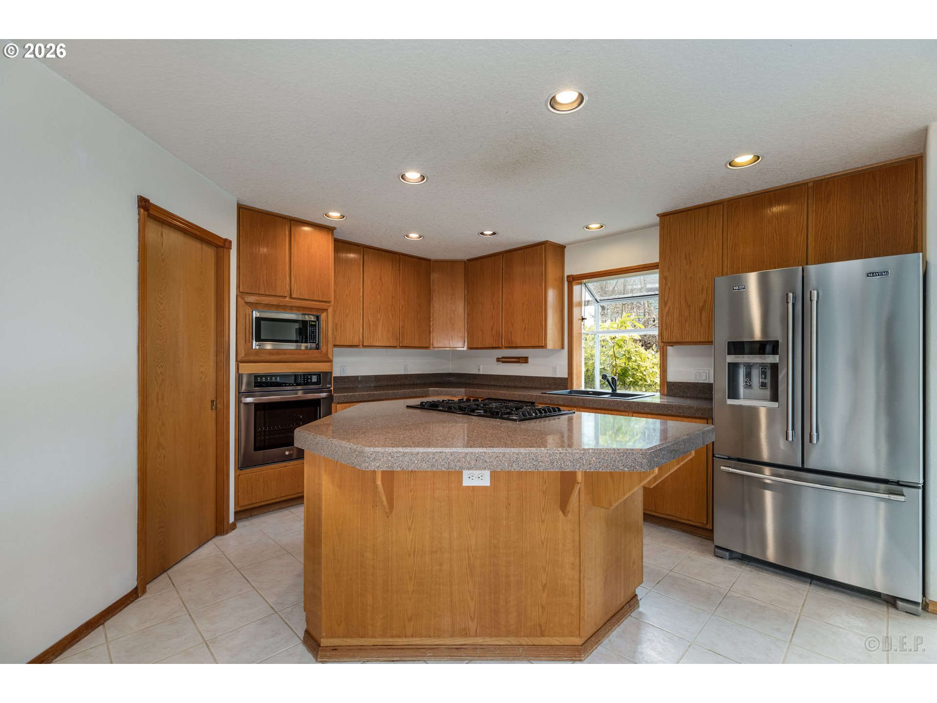 33221 Linden Street Scappoose, OR 97056 - Photo 11 of 35 a kitchen with stainless steel appliances granite countertop a refrigerator a stove a sink and a refrigerator