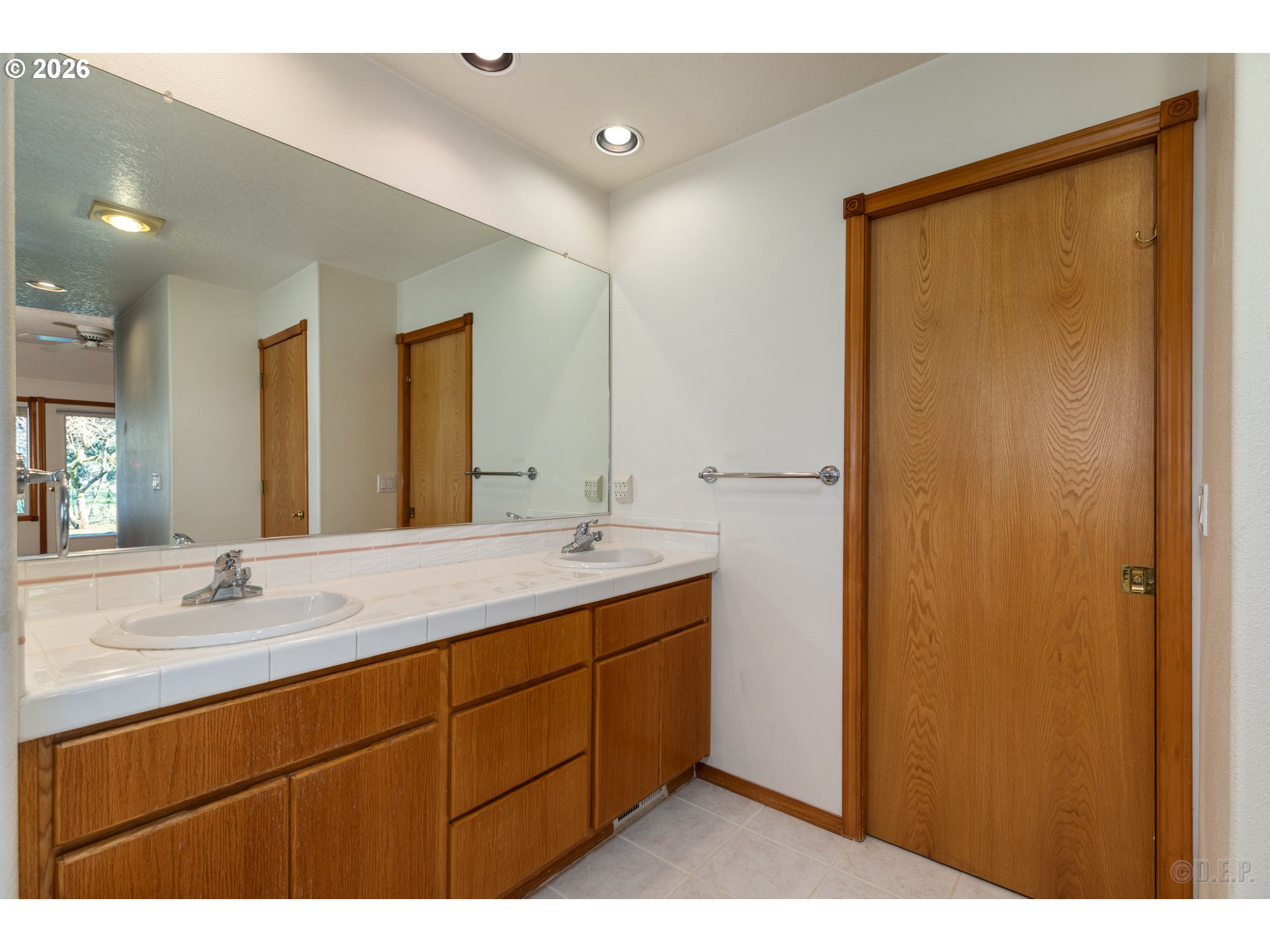 33221 Linden Street Scappoose, OR 97056 - Photo 15 of 35 a bathroom with a double vanity sink and mirror