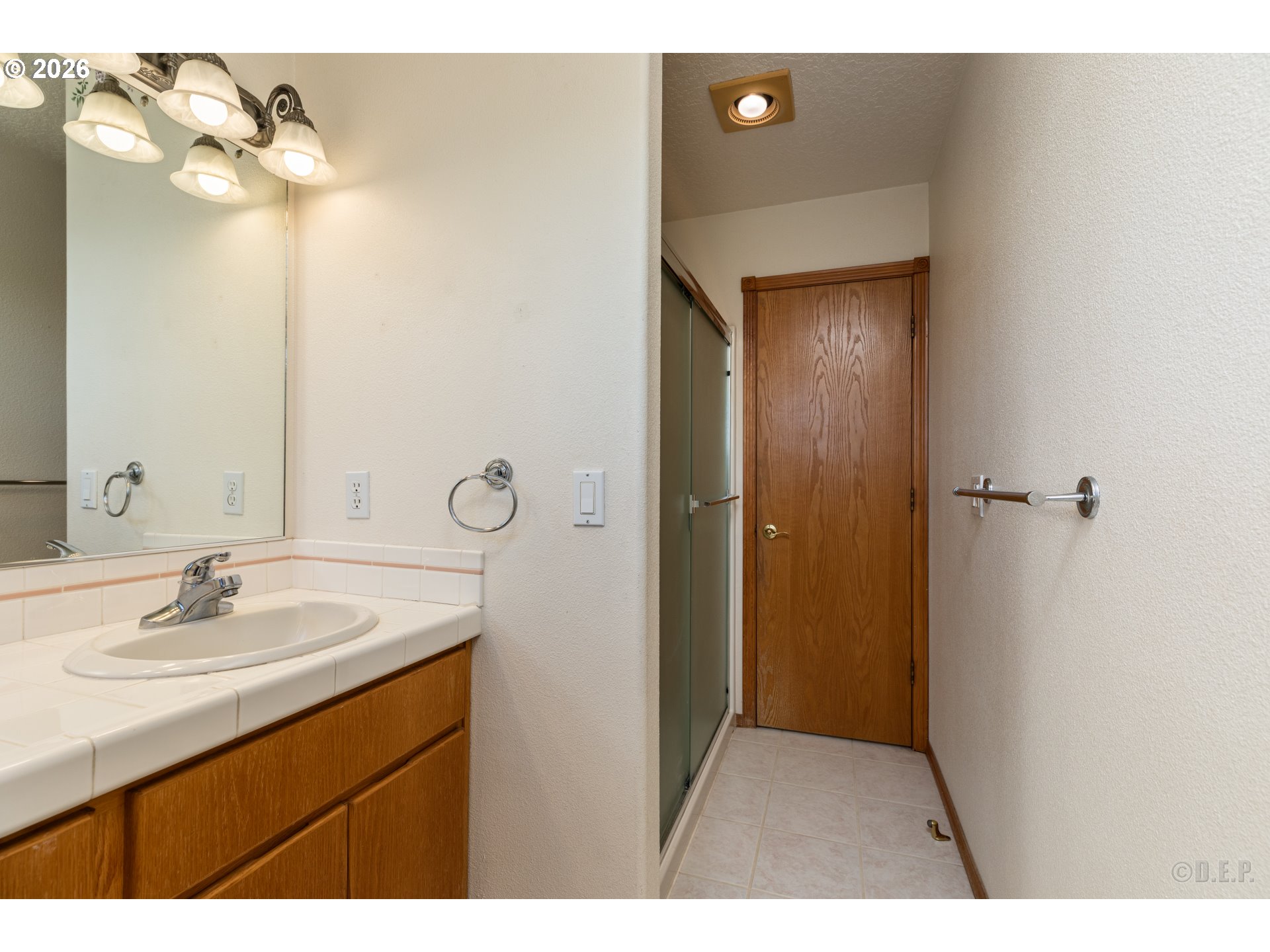 33221 Linden Street Scappoose, OR 97056 - Photo 20 of 35 a bathroom with a sink vanity and a mirror