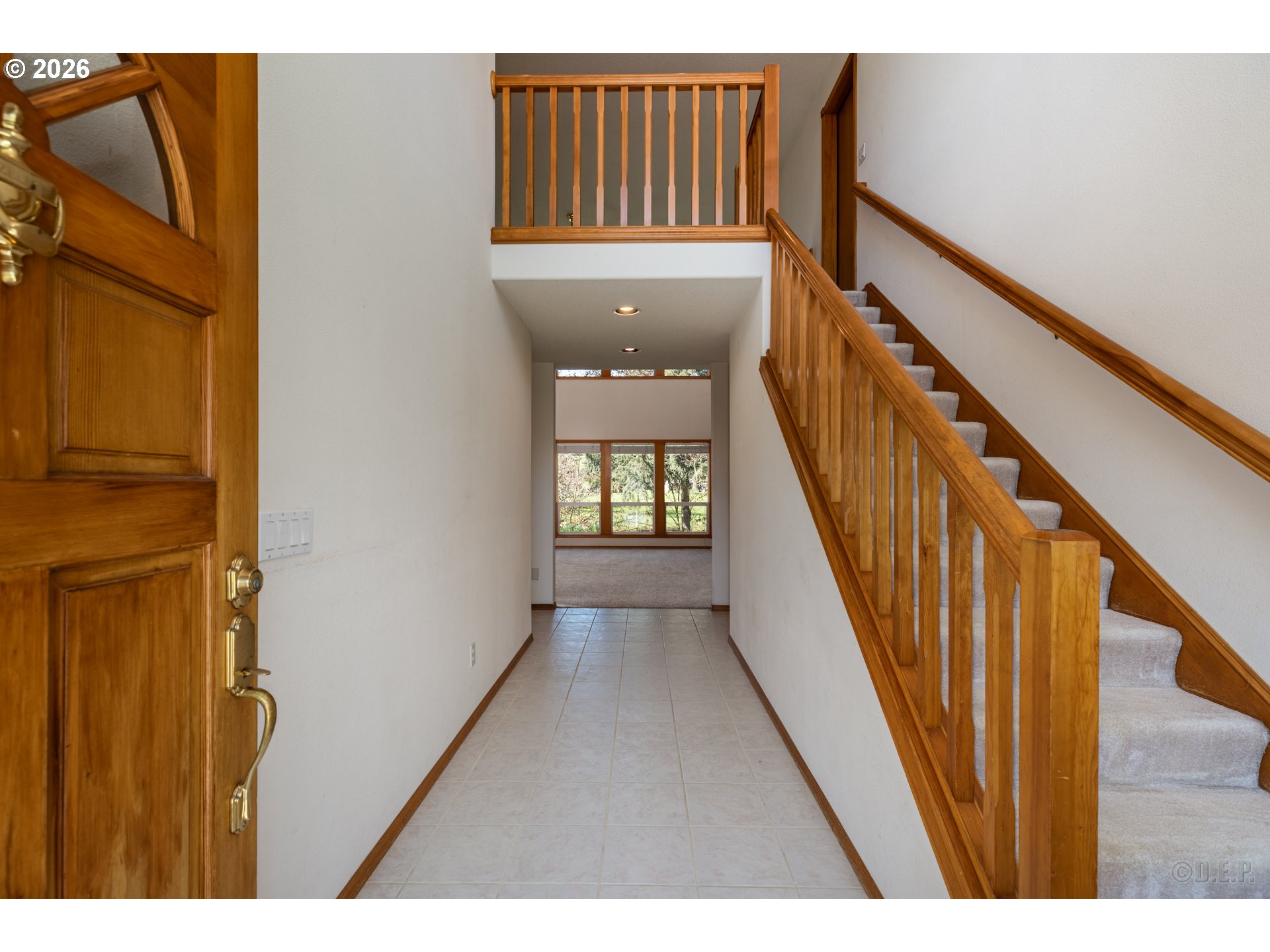 33221 Linden Street Scappoose, OR 97056 - Photo 5 of 35 a view of a hallway with wooden floor and staircase