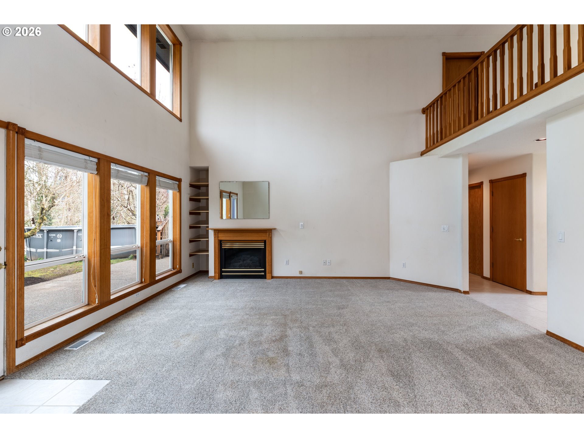 33221 Linden Street Scappoose, OR 97056 - Photo 7 of 35 a view of an empty room with fireplace and a window