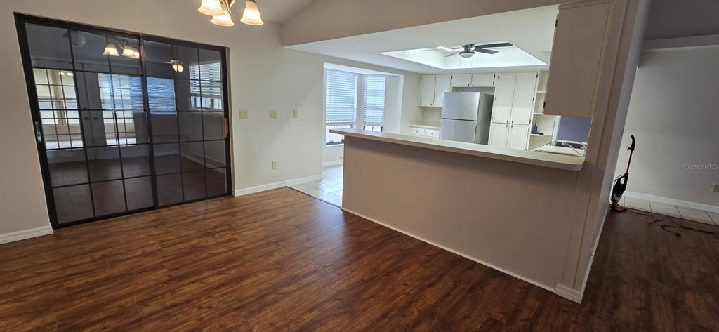 2710 Southwest 152nd Lane Ocala, FL 34473 - Photo 11 of 19 wooden floor in an empty room with a window