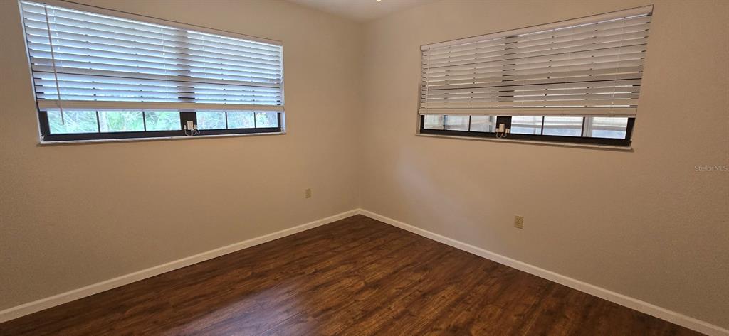 2710 Southwest 152nd Lane Ocala, FL 34473 - Photo 16 of 19 a view of empty room with wooden floor and a window