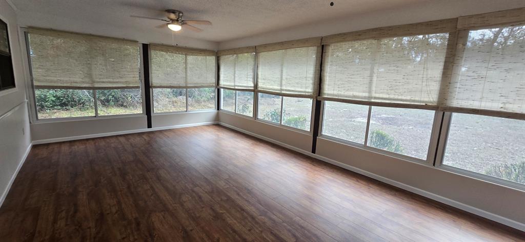 2710 Southwest 152nd Lane Ocala, FL 34473 - Photo 18 of 19 a view of empty room with wooden floor and fan