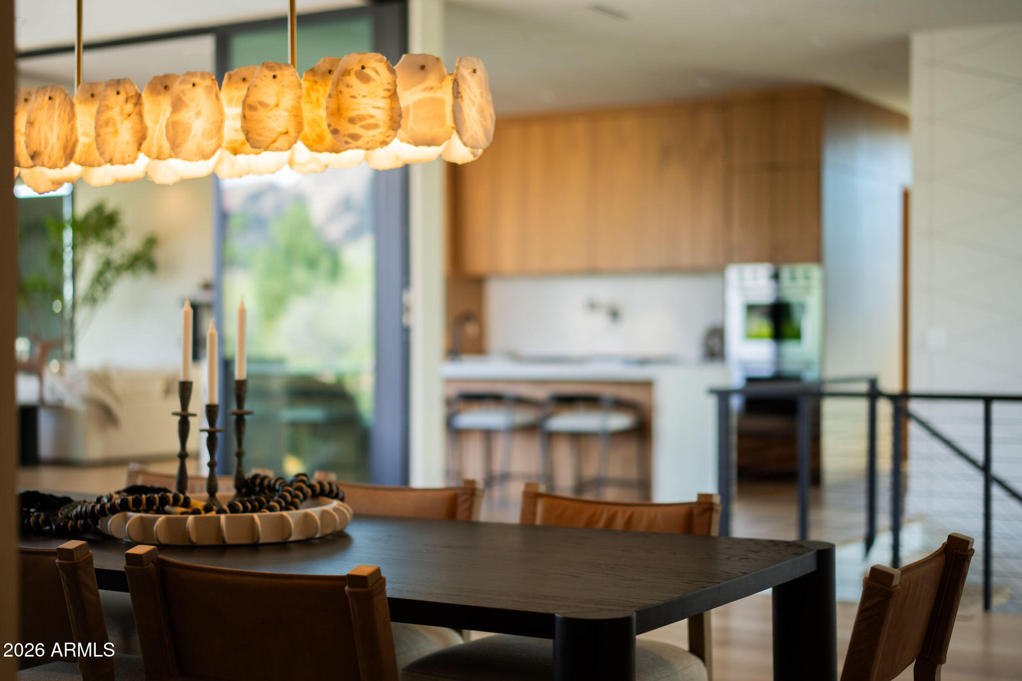 a kitchen with a table chairs and stove