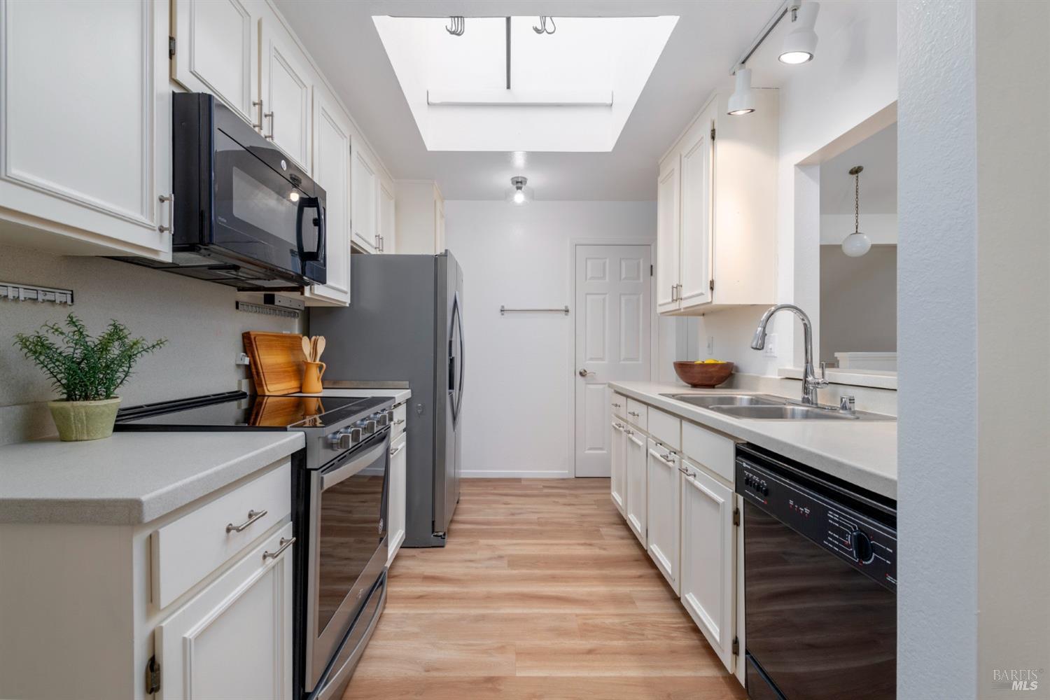 968 Arlene Way Novato, CA 94947 - Photo 12 of 32 a kitchen with stainless steel appliances granite countertop a sink stove and refrigerator