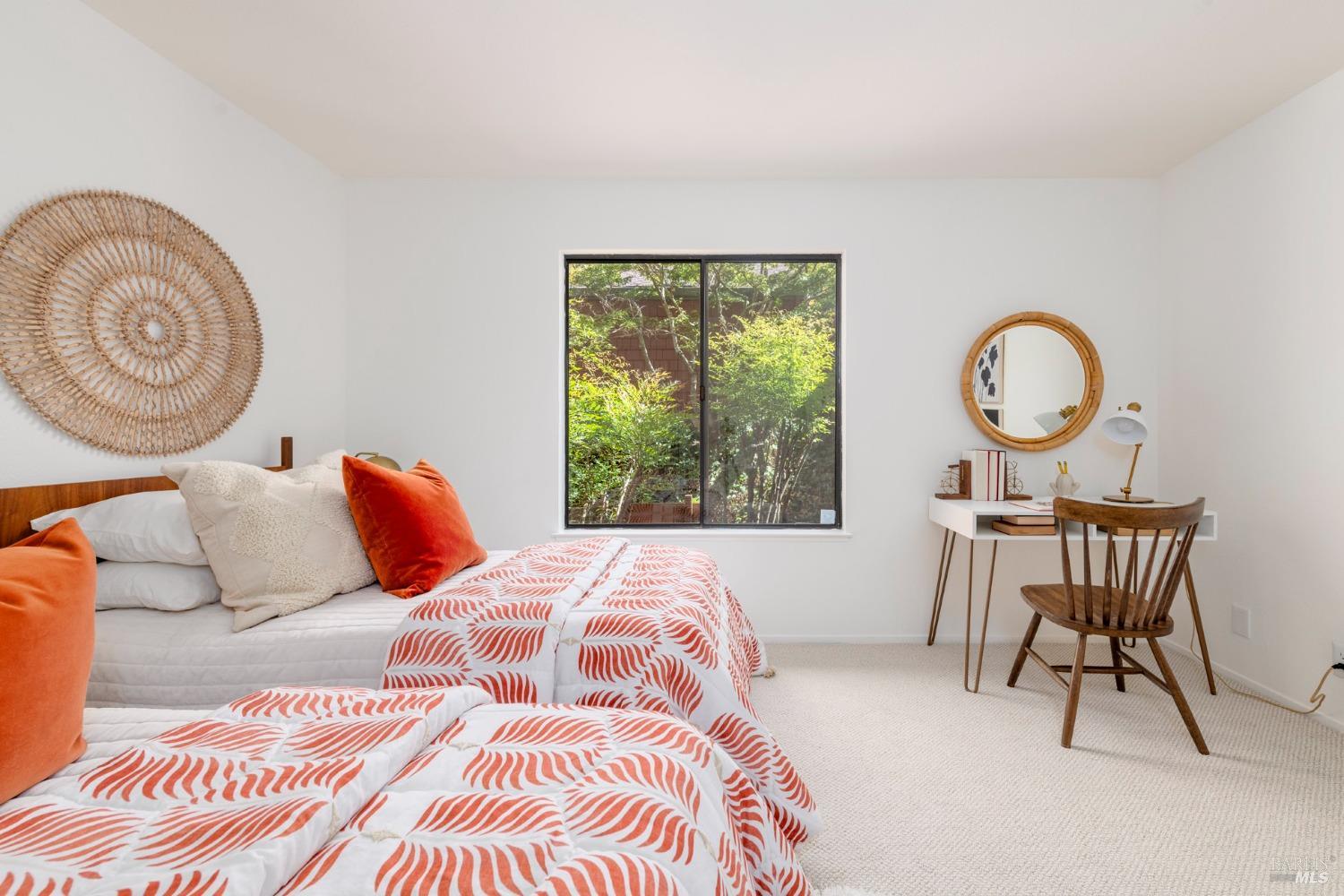 968 Arlene Way Novato, CA 94947 - Photo 19 of 32 a bedroom with a bed a mirror and a table