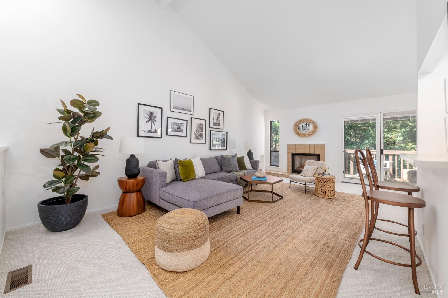 968 Arlene Way Novato, CA 94947 - Photo 7 of 32 a living room with furniture potted plant and a fireplace