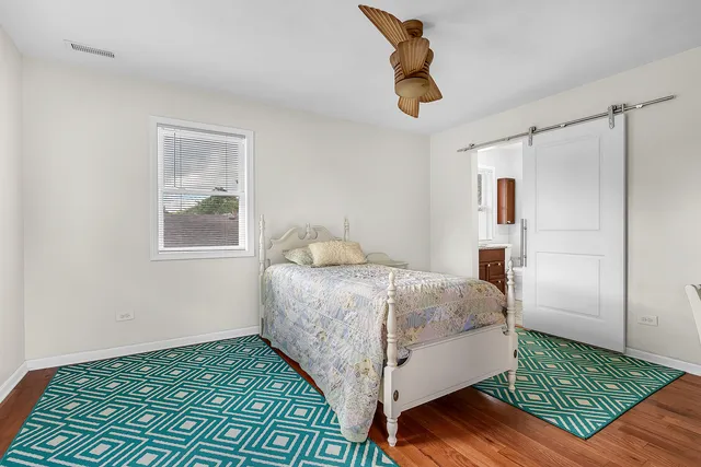 a bedroom with a bed and cabinets