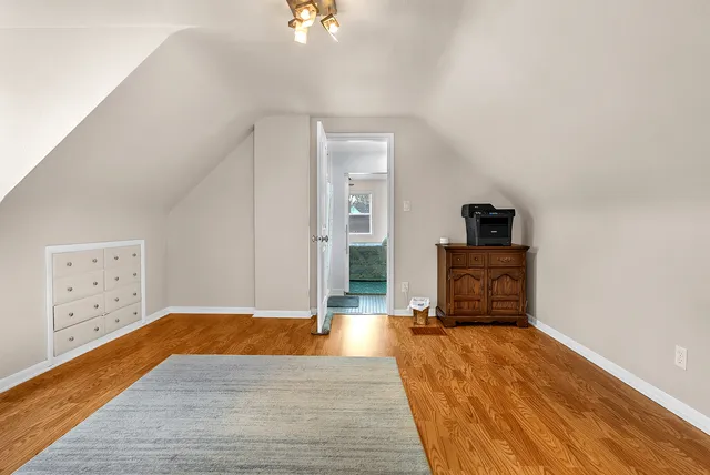 a view of a livingroom with wooden floor
