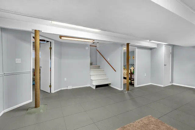 a view of an empty room with stairs