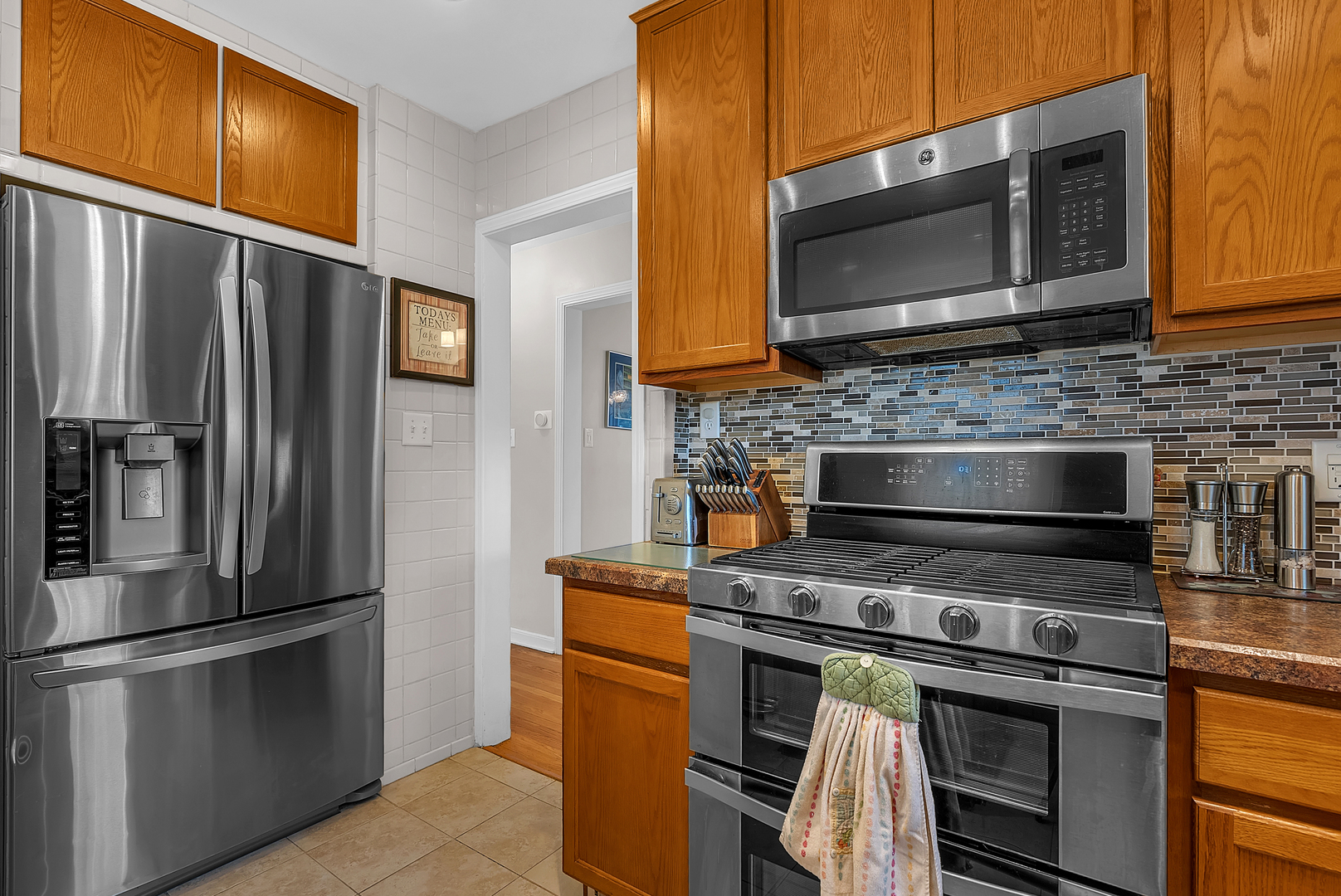 17803 Escanaba Avenue Lansing, IL 60438 - Photo 9 of 31 a kitchen with stainless steel appliances and cabinets