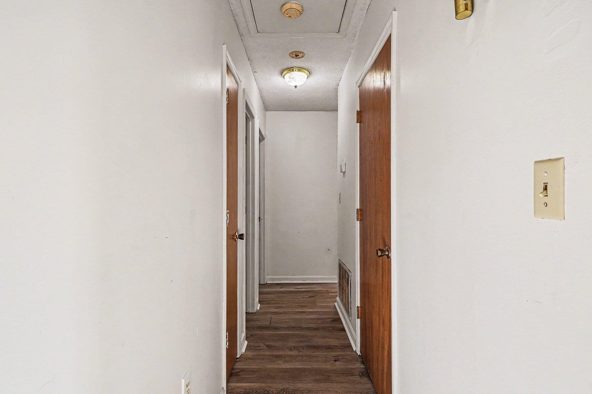 916 Brinkley Street Georgetown, SC 29440 - Photo 12 of 39 Hallway featuring dark wood-style flooring