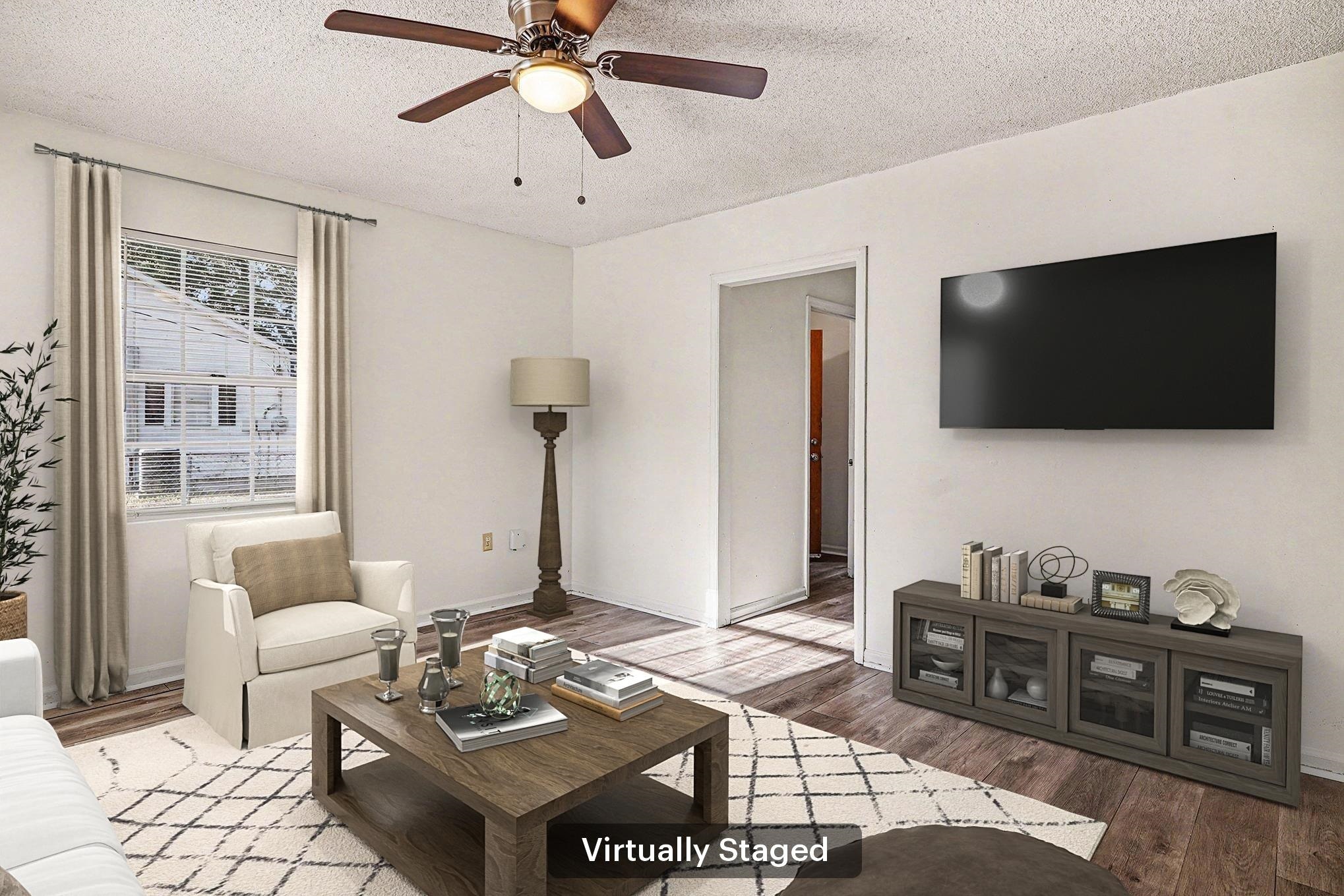 916 Brinkley Street Georgetown, SC 29440 - Photo 3 of 39 Living room featuring a textured ceiling, wood finished floors, and ceiling fan