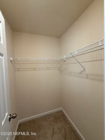 a view of a room with racks on the wall
