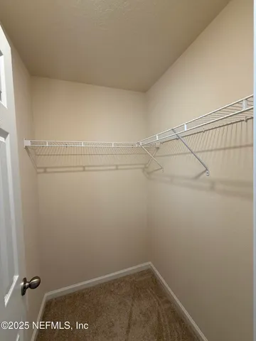 a view of a room with racks on the wall