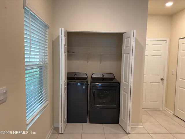 a bathroom with a glass door shower and a sink