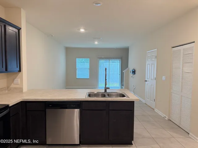 a bathroom with a sink vanity and mirror