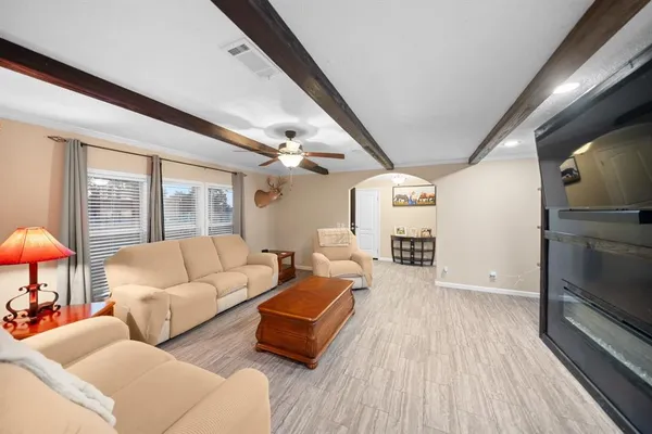 a living room with furniture and a large window