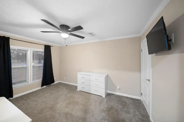 a view of an empty room with a flat screen tv