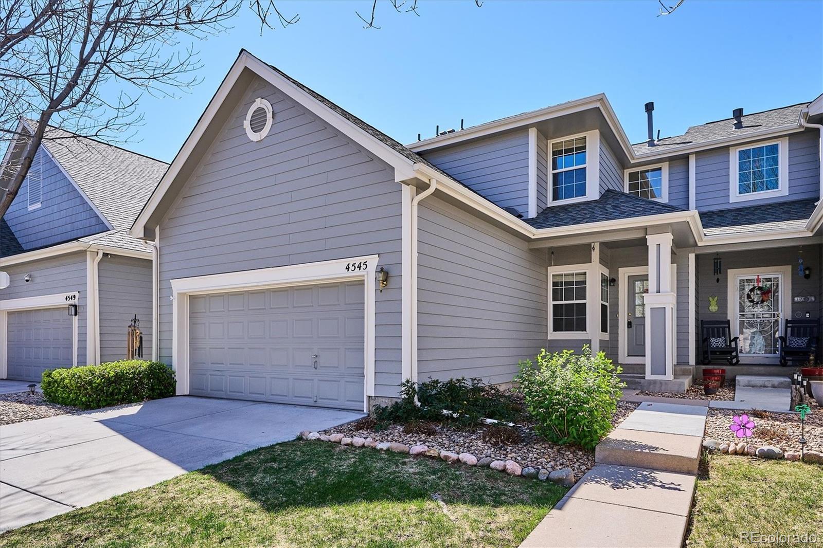 4545 South Taft Way Morrison, CO 80465 - Photo 3 of 24 a front view of a house with garden