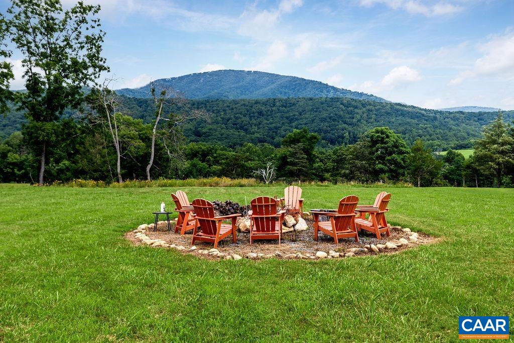 a view of a table and chairs in the garden