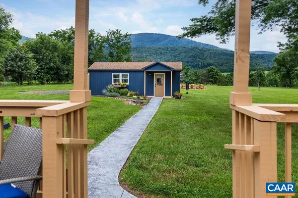 a view of a livingroom with furniture and wooden floor