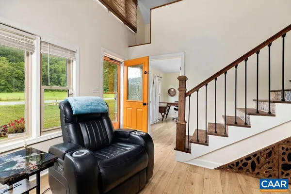 a living room with furniture fireplace and flat screen tv
