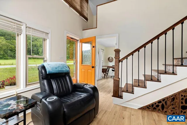 a living room with furniture fireplace and flat screen tv
