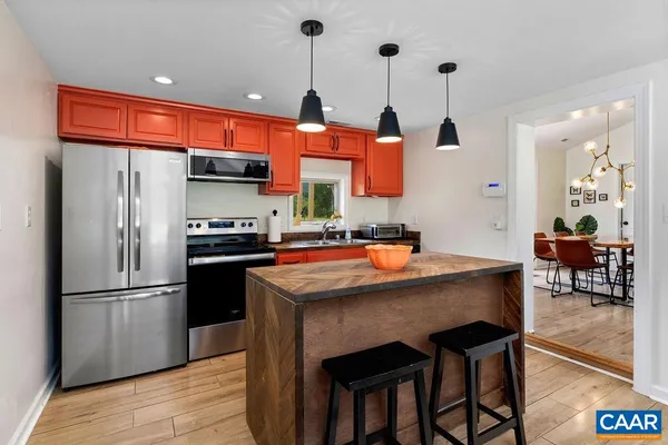 a kitchen with a stove and a sink