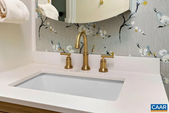 a dining room with furniture and a large window