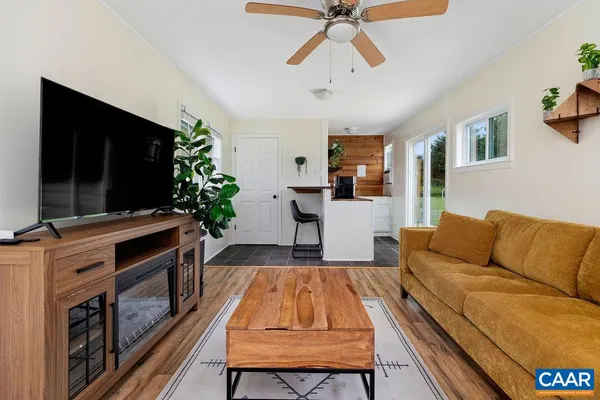 a kitchen with stainless steel appliances granite countertop a sink and a stove