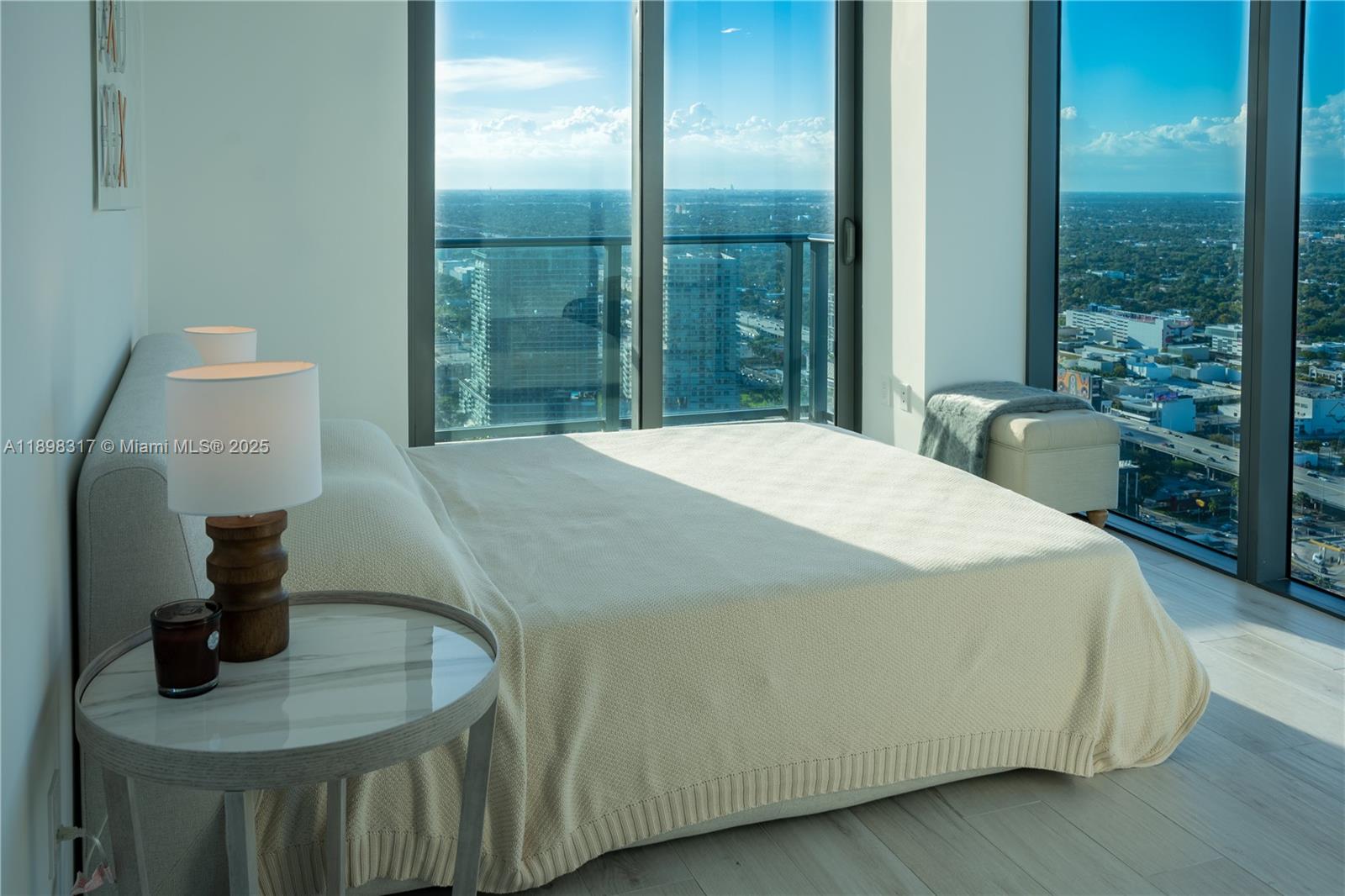 3131 Northeast 7th Avenue, Unit PH4903 Miami, FL 33137 - Photo 12 of 33 a bedroom with a bed and window