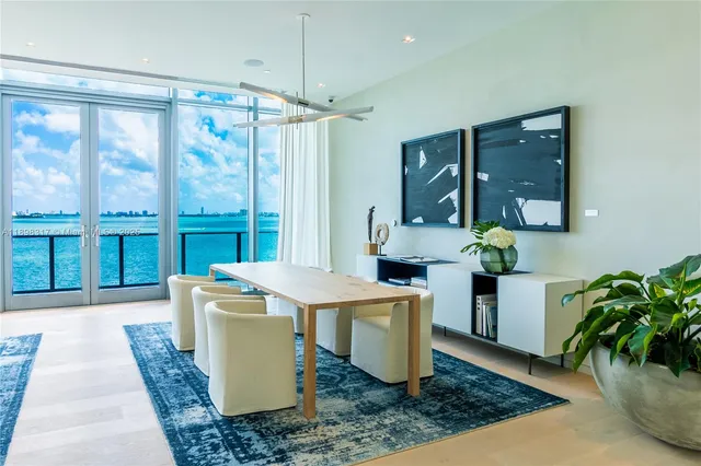 a living room with furniture and flowers