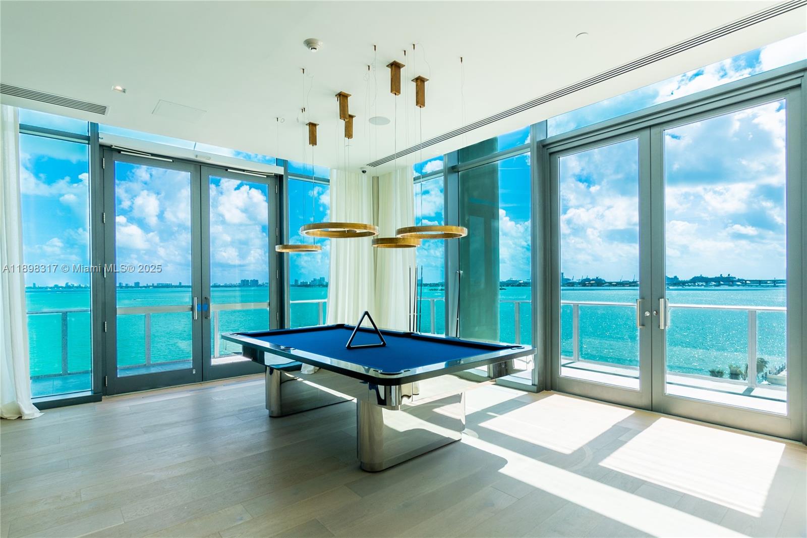 3131 Northeast 7th Avenue, Unit PH4903 Miami, FL 33137 - Photo 27 of 33 a room with pool table and windows