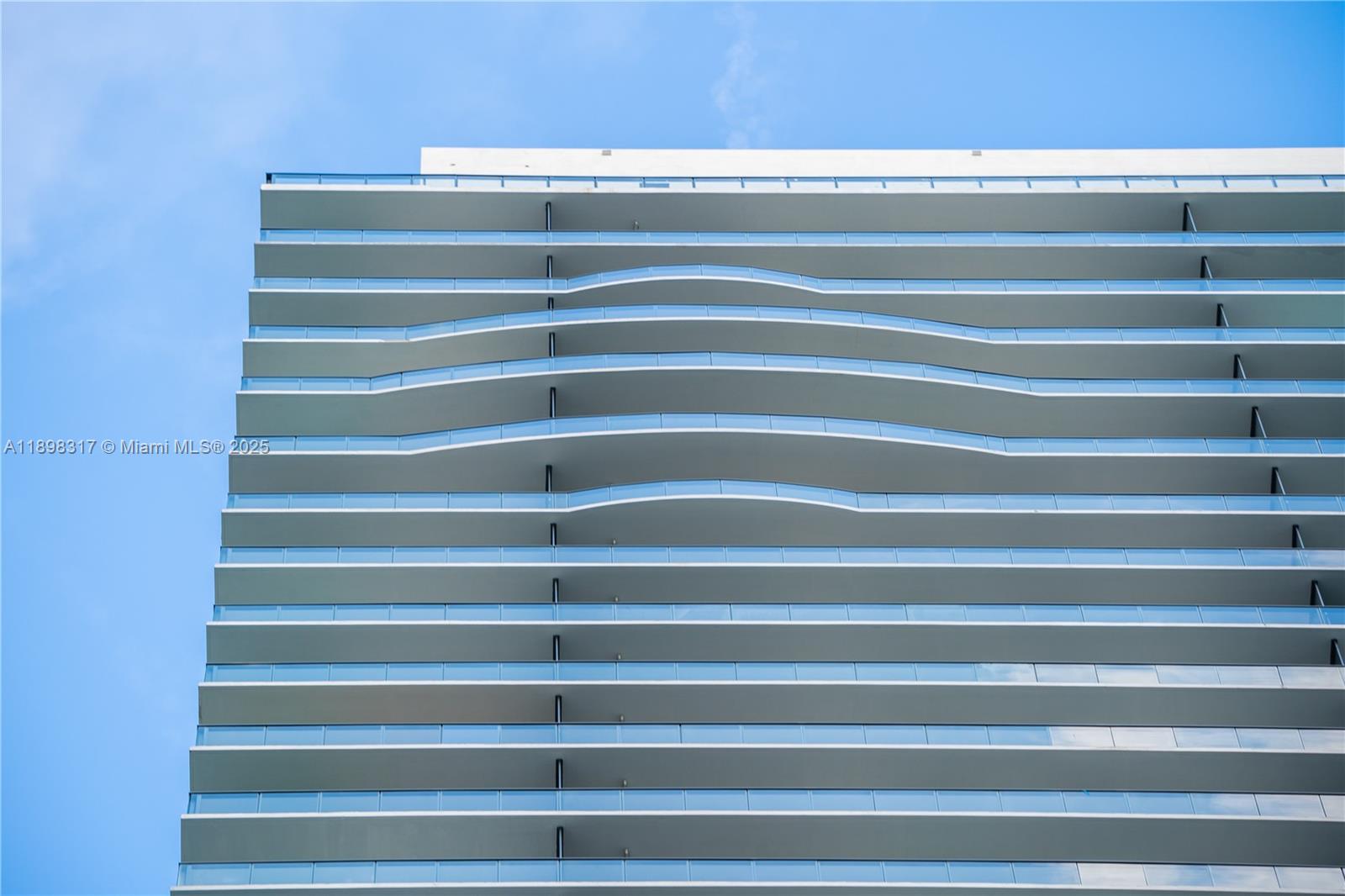 3131 Northeast 7th Avenue, Unit PH4903 Miami, FL 33137 - Photo 33 of 33 a view of walk in closet with empty racks